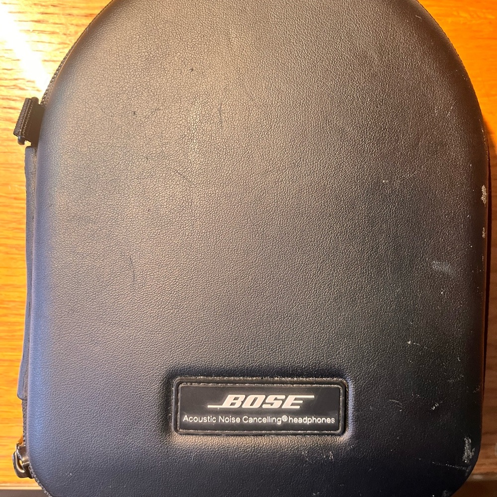 Used Bose noise canceling headphones, rechargeable, high quality sound.